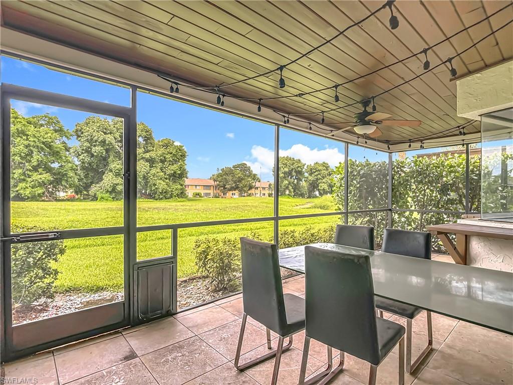 183 Round Key Circle, Unit D4 Naples, FL 34112 - Photo 43 of 49 a view of a city from a dining room with large windows