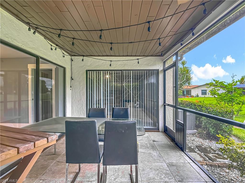 183 Round Key Circle, Unit D4 Naples, FL 34112 - Photo 45 of 49 a balcony with furniture and a potted plant