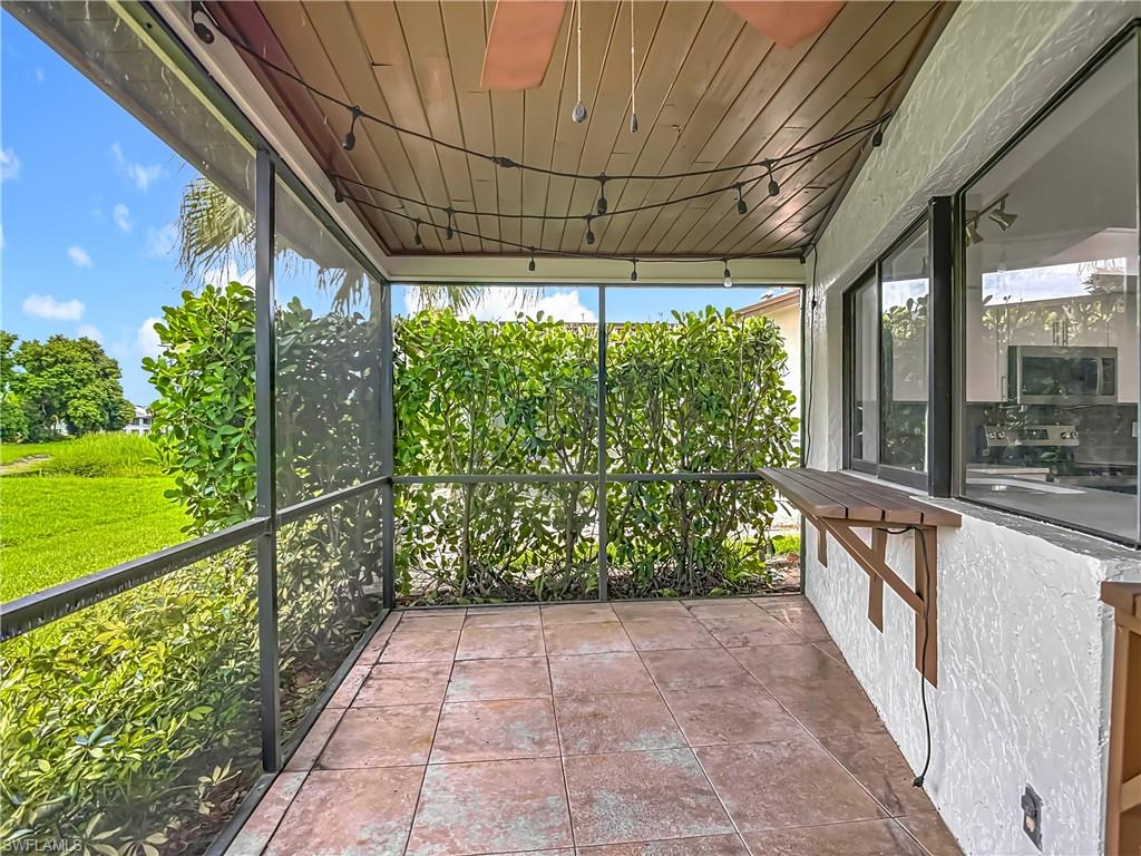 183 Round Key Circle, Unit D4 Naples, FL 34112 - Photo 46 of 49 a view of a pathway with a porch