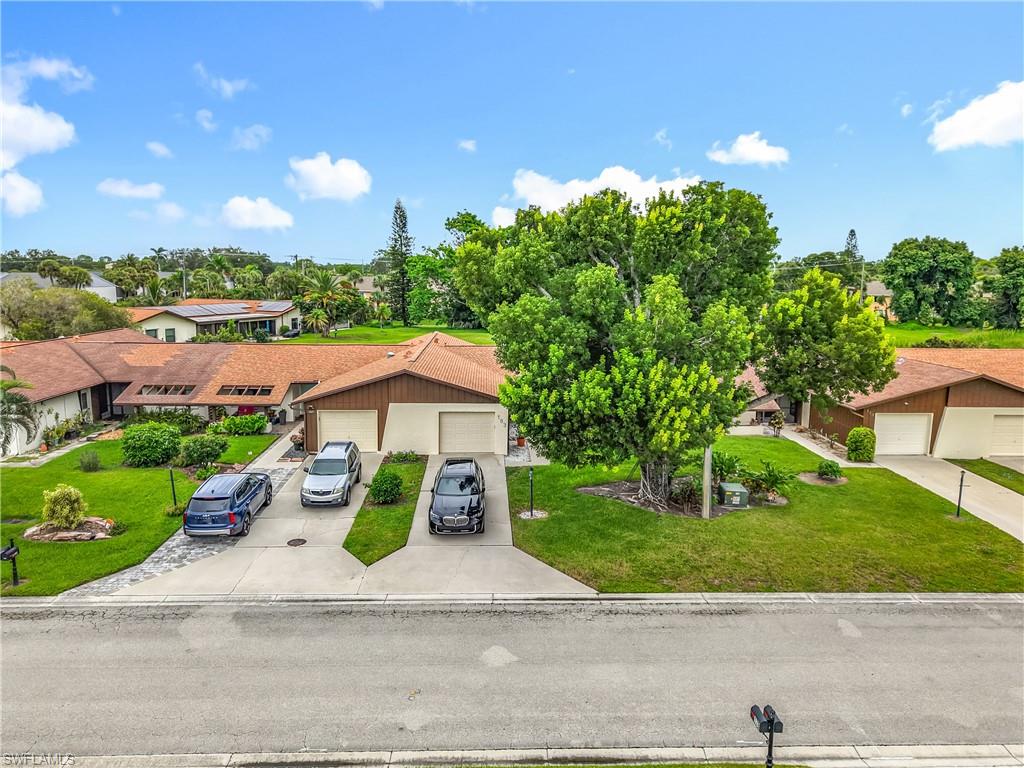 183 Round Key Circle, Unit D4 Naples, FL 34112 - Photo 6 of 49 a view of a street with houses