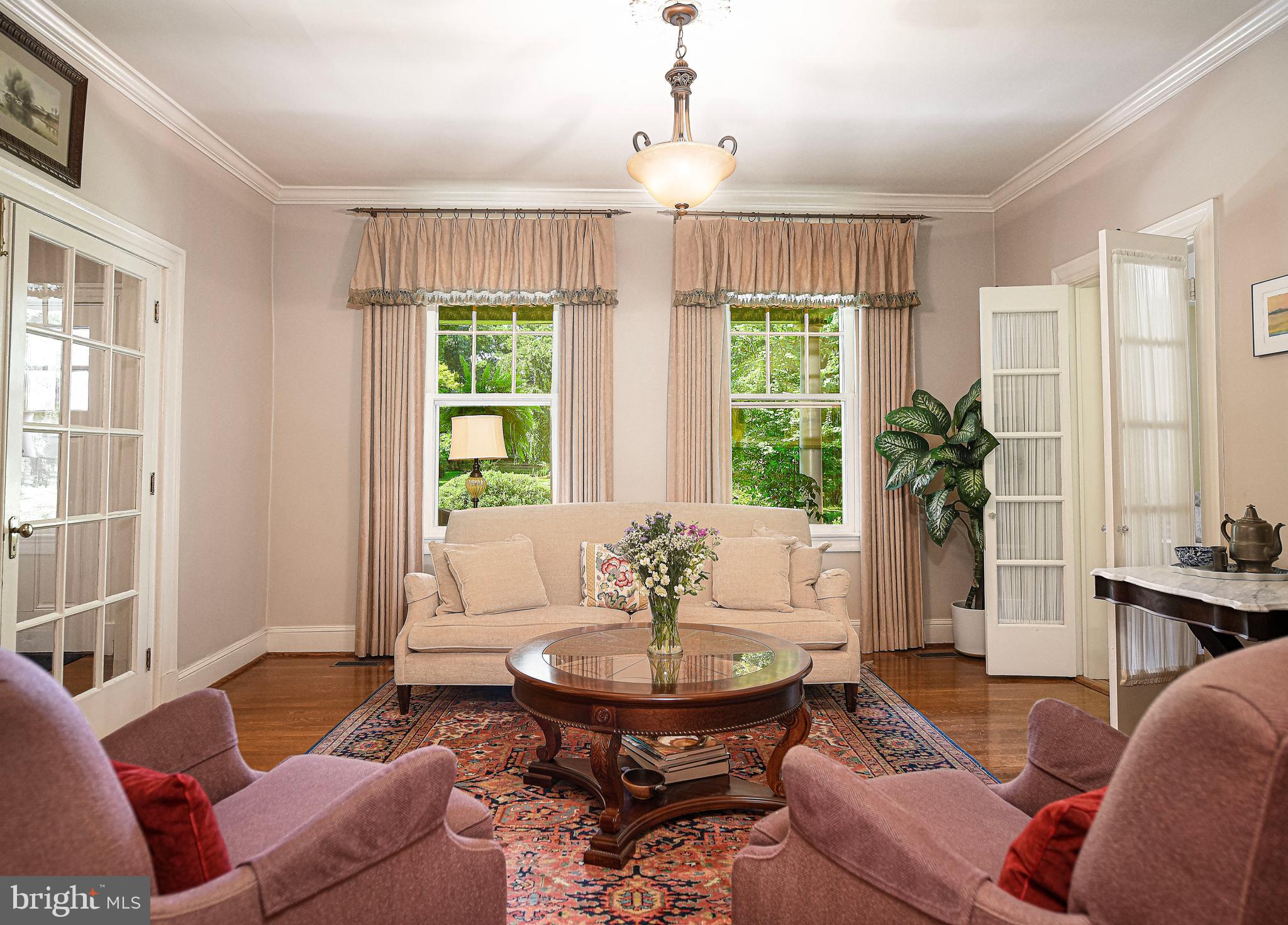 1014 Windsor Road Baltimore, MD 21208 - Photo 14 of 50 Living room with french doors and crown molding