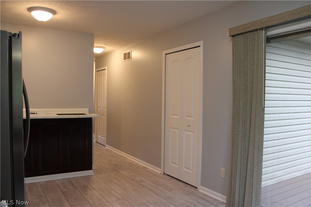202 Home Street Rittman, OH 44270 - Photo 27 of 47 Wood-finish flooring with white trim and grey walls