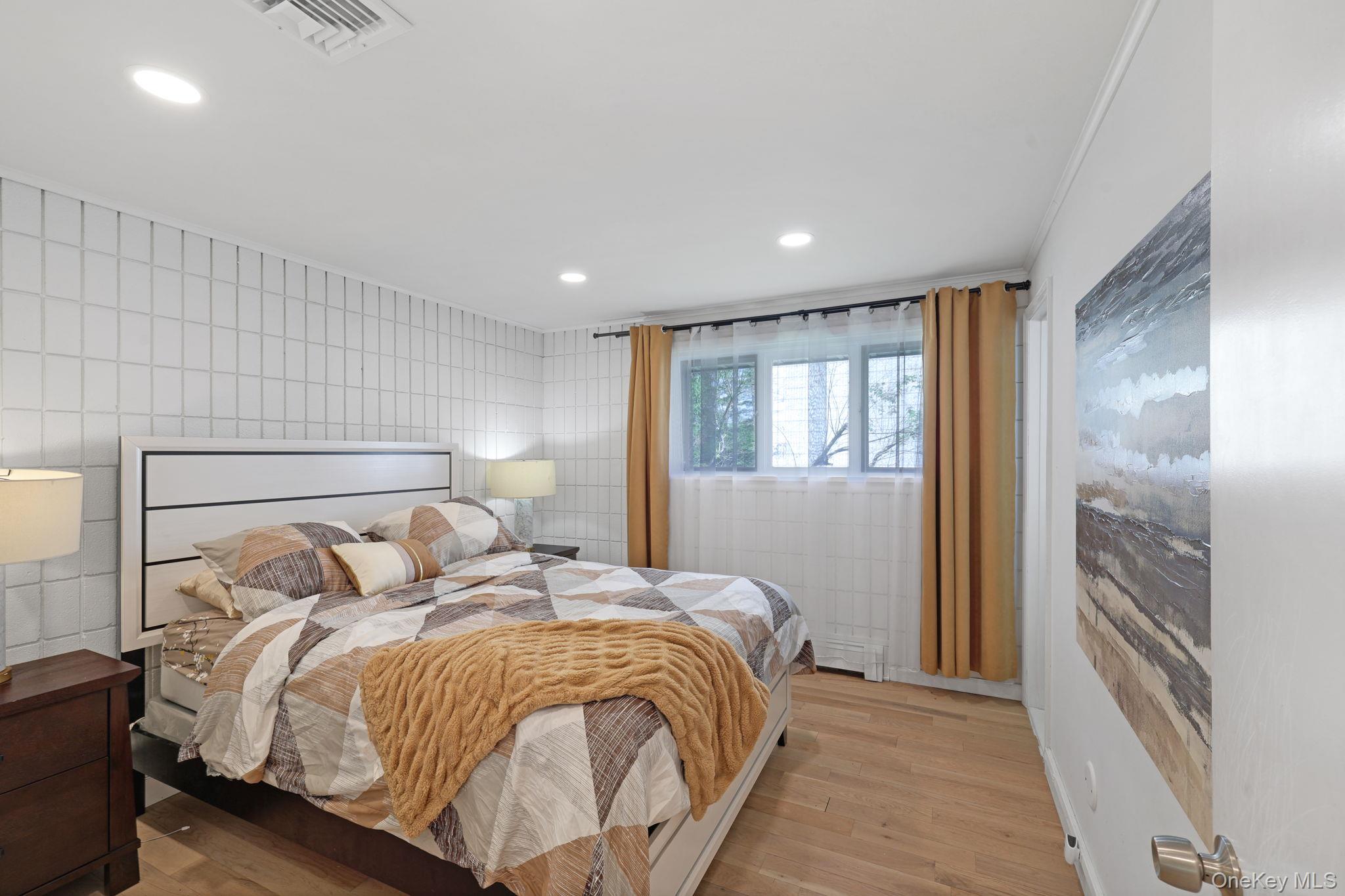 35 Kroeger Road Monticello, NY 12701 - Photo 13 of 29 a bedroom with a bed and a large mirror