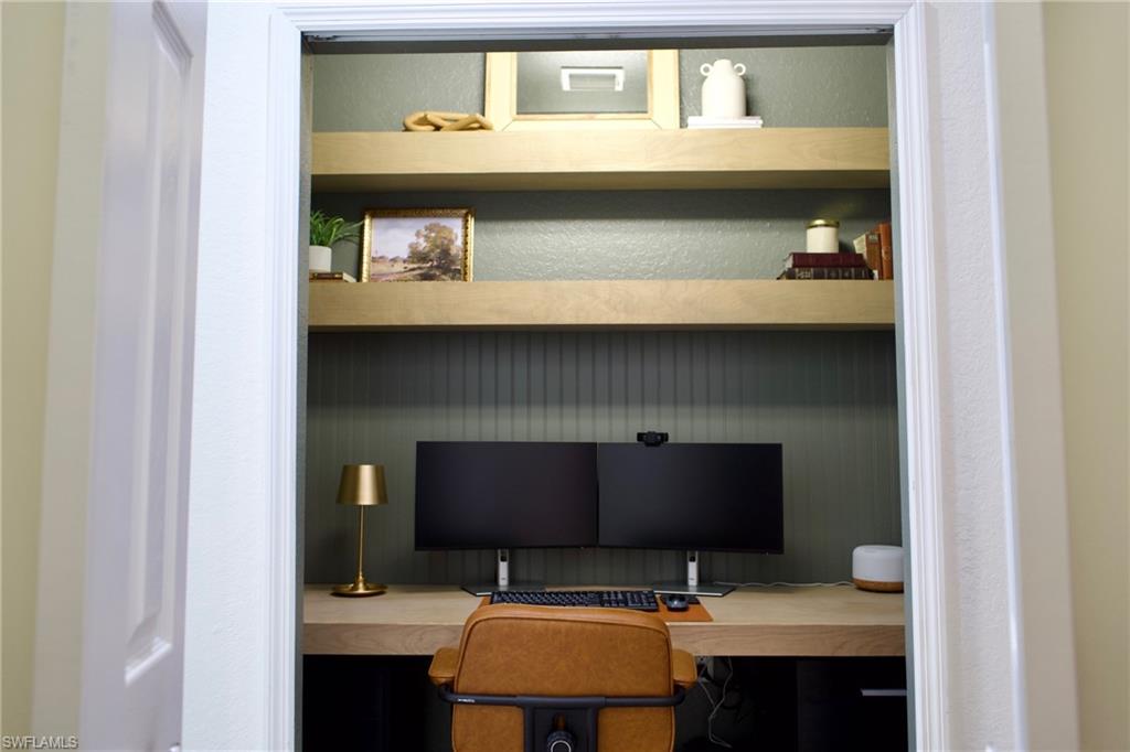 3944 Ruxton Road Naples, FL 34116 - Photo 16 of 27 a bathroom with a sink and a mirror