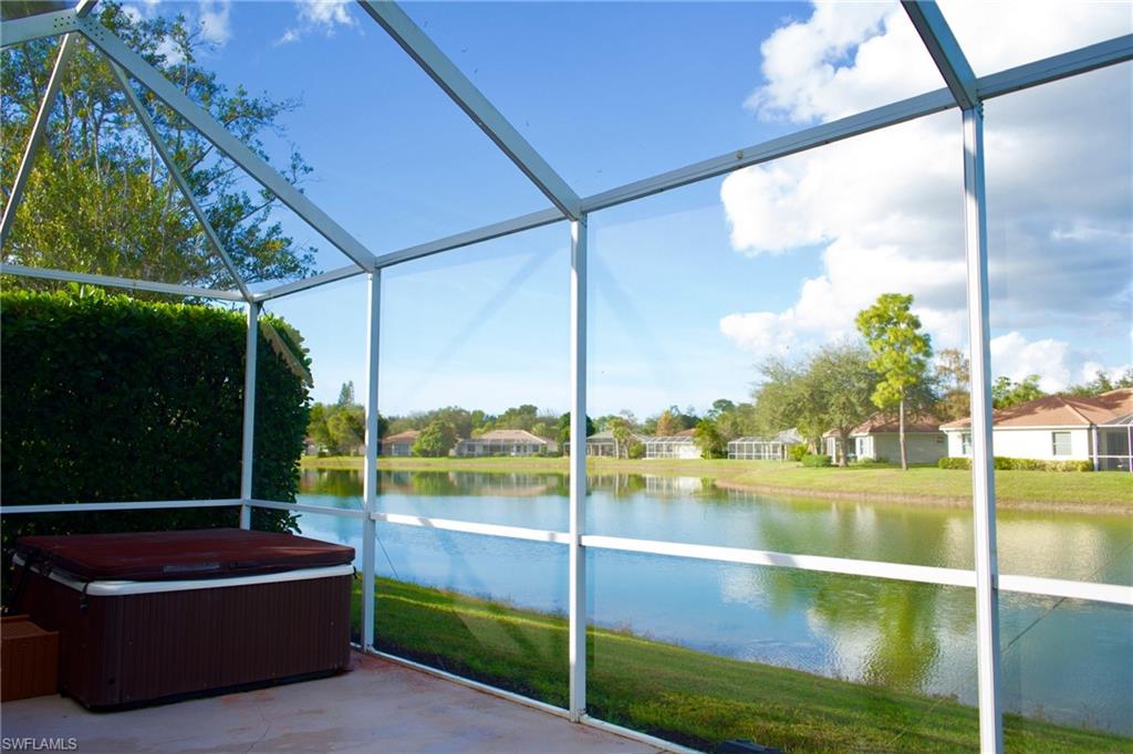 3944 Ruxton Road Naples, FL 34116 - Photo 2 of 27 a view of a floor to ceiling window and a small yard