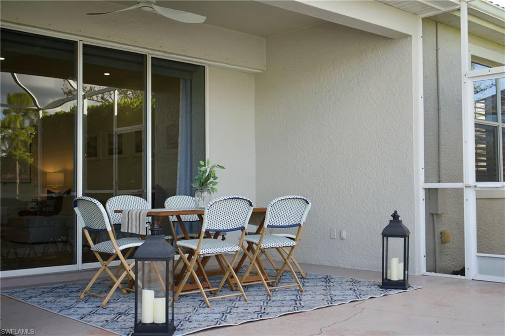 3944 Ruxton Road Naples, FL 34116 - Photo 23 of 27 a dining room with furniture and window