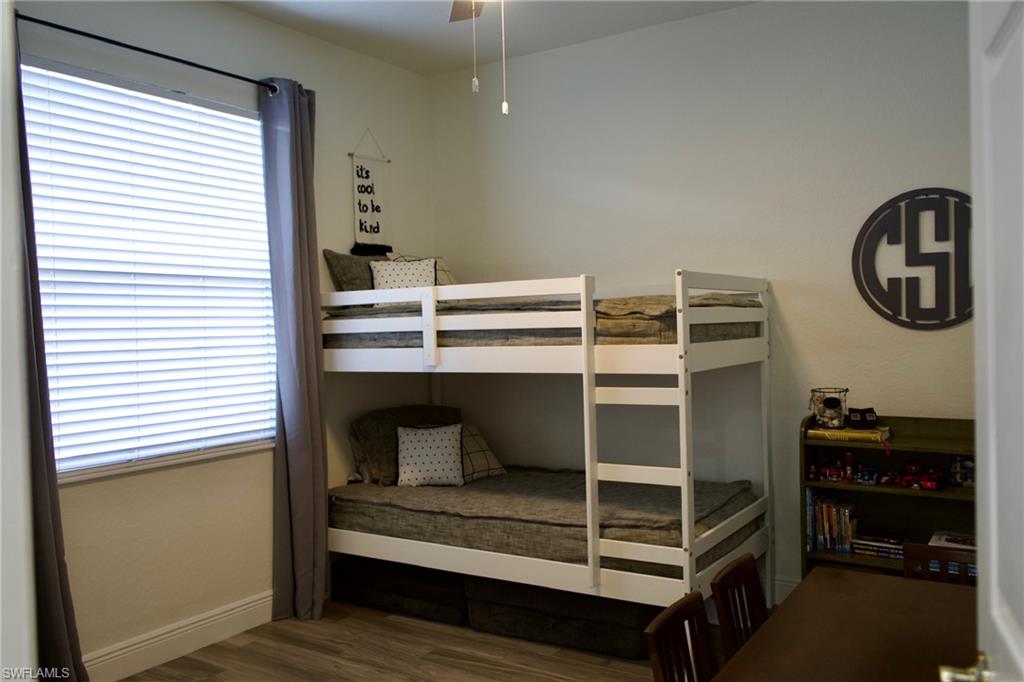 3944 Ruxton Road Naples, FL 34116 - Photo 24 of 27 a view of room with rack on the wall