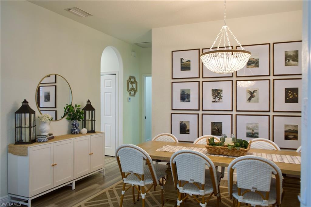 3944 Ruxton Road Naples, FL 34116 - Photo 4 of 27 a dining room with furniture and window