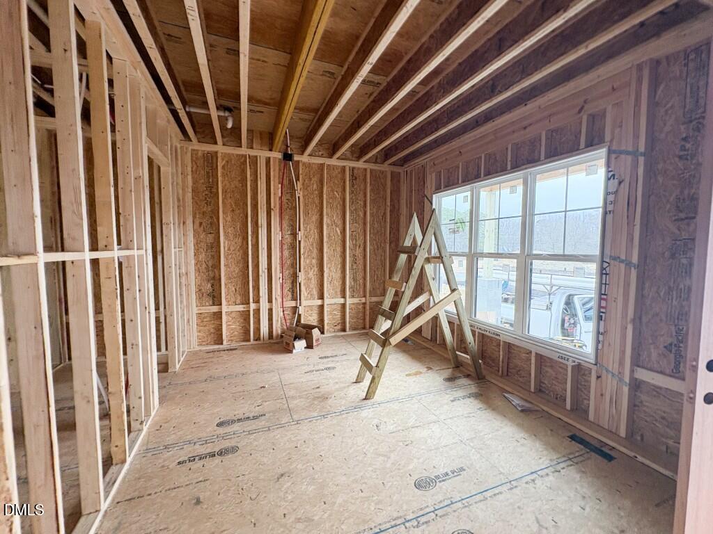 5824 Carriage Gate Drive Raleigh, NC 27603 - Photo 10 of 19 a view of an empty room with a window