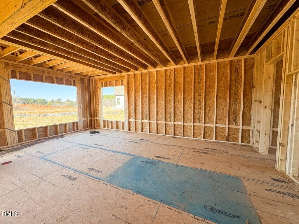 5824 Carriage Gate Drive Raleigh, NC 27603 - Photo 7 of 17 a view of an empty room with a window