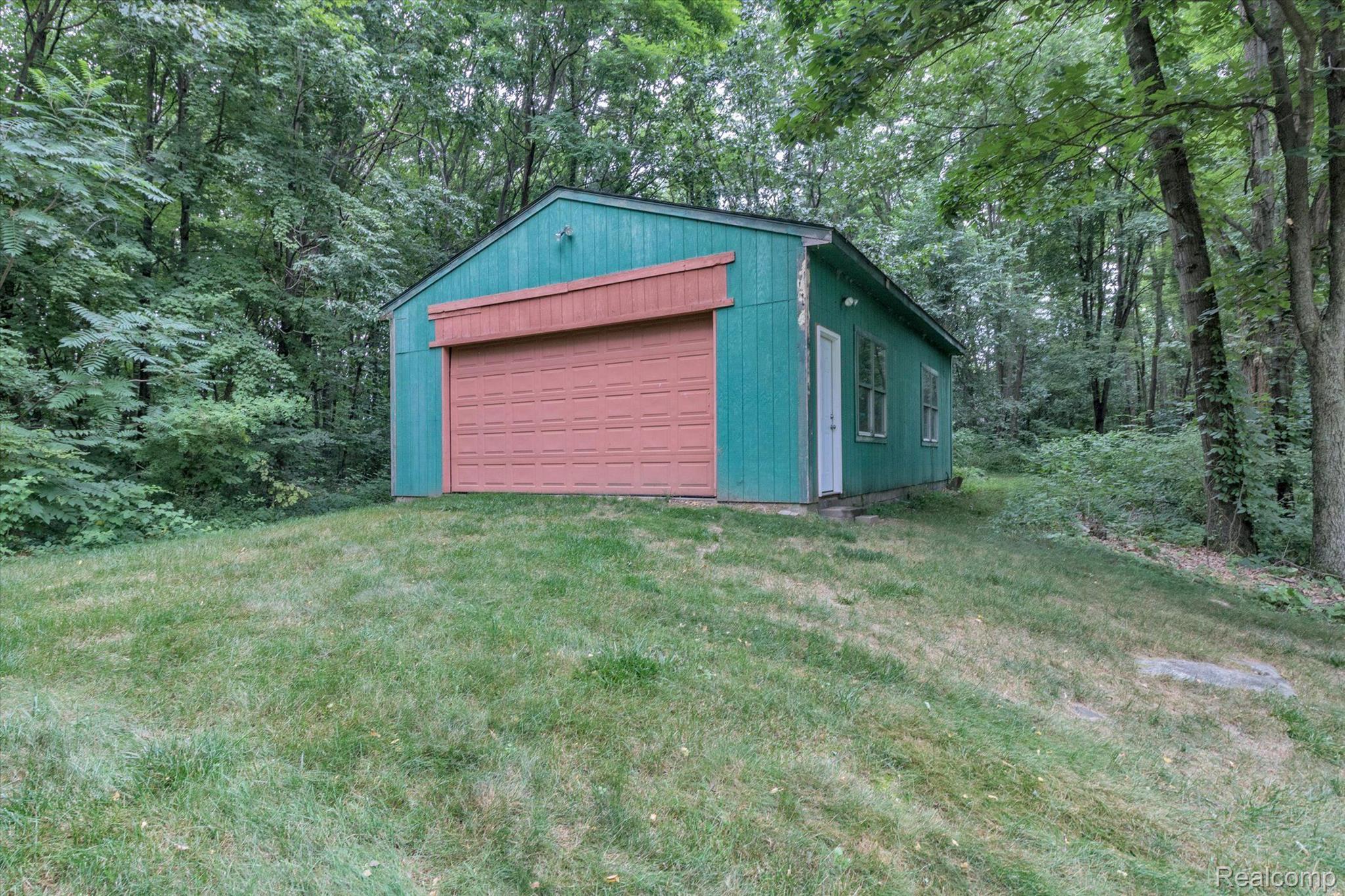 1744 Peavy Road Howell, MI 48843 - Photo 3 of 34 24x36 pole barn w/8x16 overhead door + side door