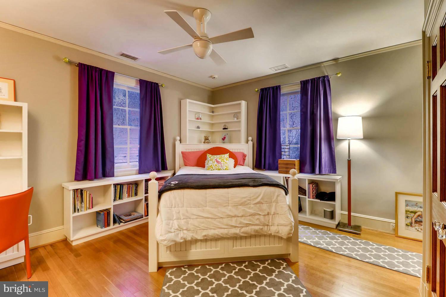 301 Somerset Road Baltimore, MD 21210 - Photo 20 of 30 a bedroom with furniture and a chandelier