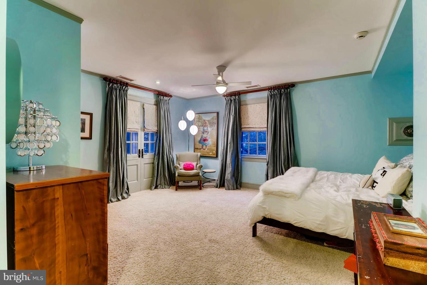 301 Somerset Road Baltimore, MD 21210 - Photo 21 of 30 a bedroom with a bed and flat screen tv