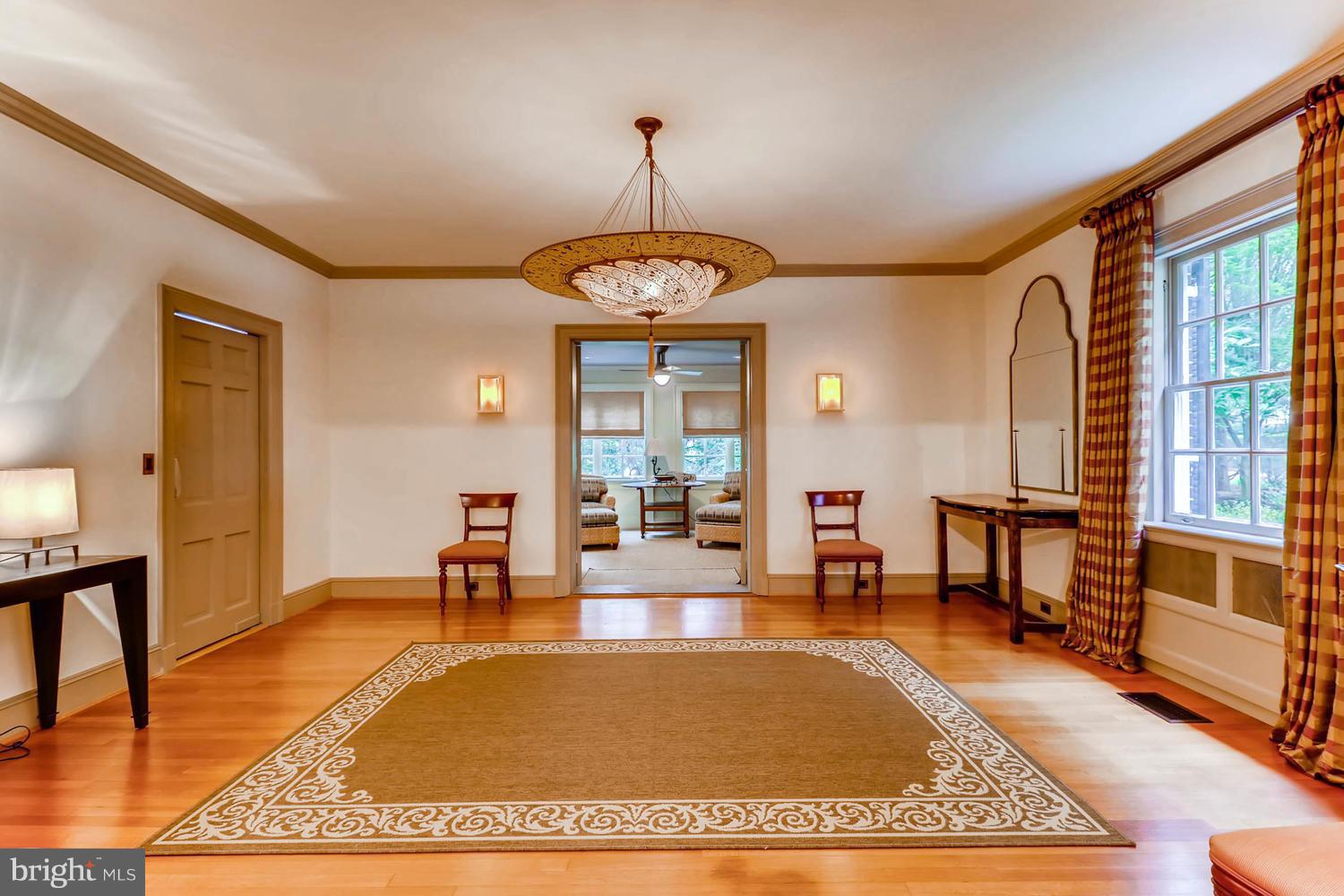 301 Somerset Road Baltimore, MD 21210 - Photo 6 of 30 a living room with a table or chandelier and a rug