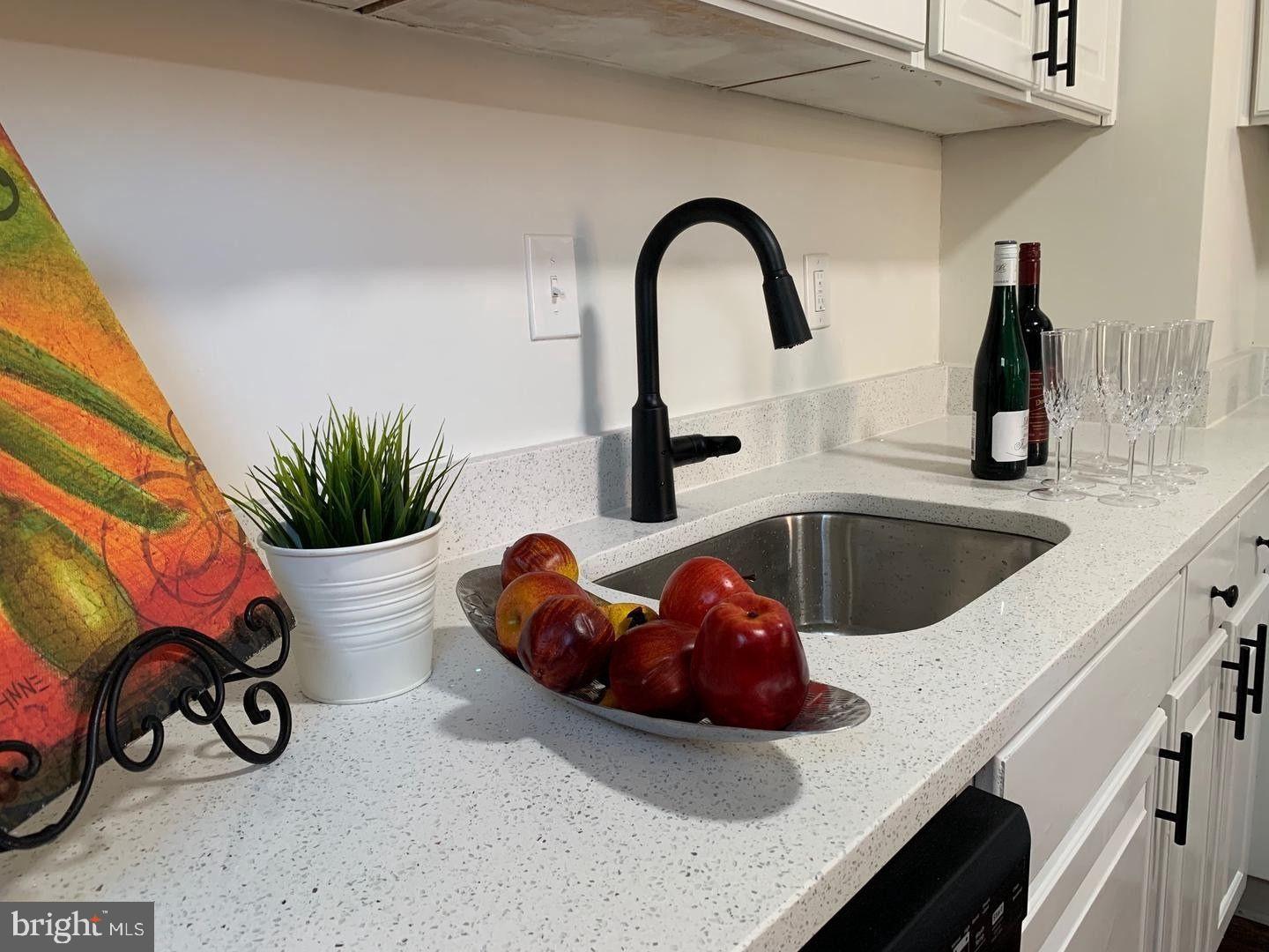 9407 Colesville Road Silver Spring, MD 20901 - Photo 16 of 47 Modern kitchen with vibrant accents.