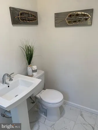a bath tub sitting in a bathroom next to a window