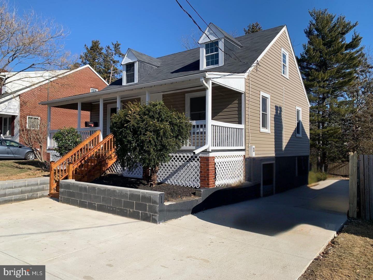 9407 Colesville Road Silver Spring, MD 20901 - Photo 2 of 47 Charming home with inviting porch and greenery.