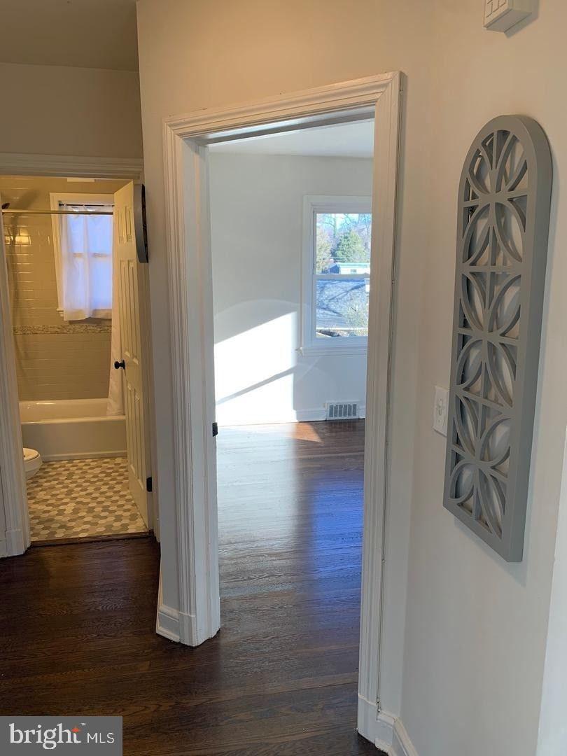 9407 Colesville Road Silver Spring, MD 20901 - Photo 21 of 47 Inviting hallway with natural light.