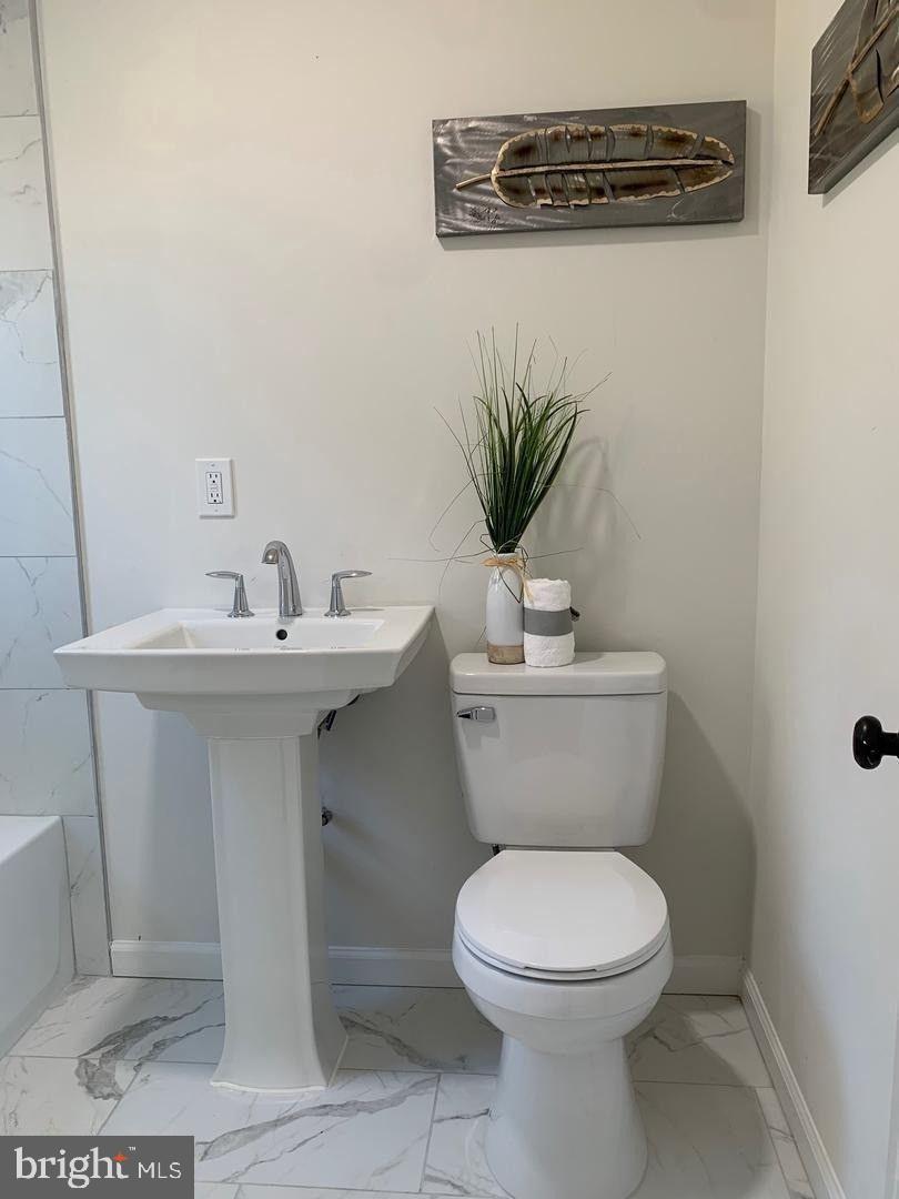 9407 Colesville Road Silver Spring, MD 20901 - Photo 22 of 43 Modern bathroom with sleek fixtures.