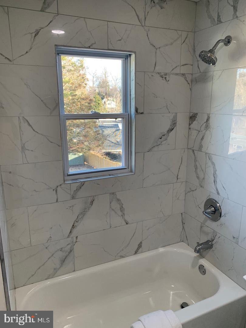 9407 Colesville Road Silver Spring, MD 20901 - Photo 24 of 47 Elegant bathroom with marble accents.