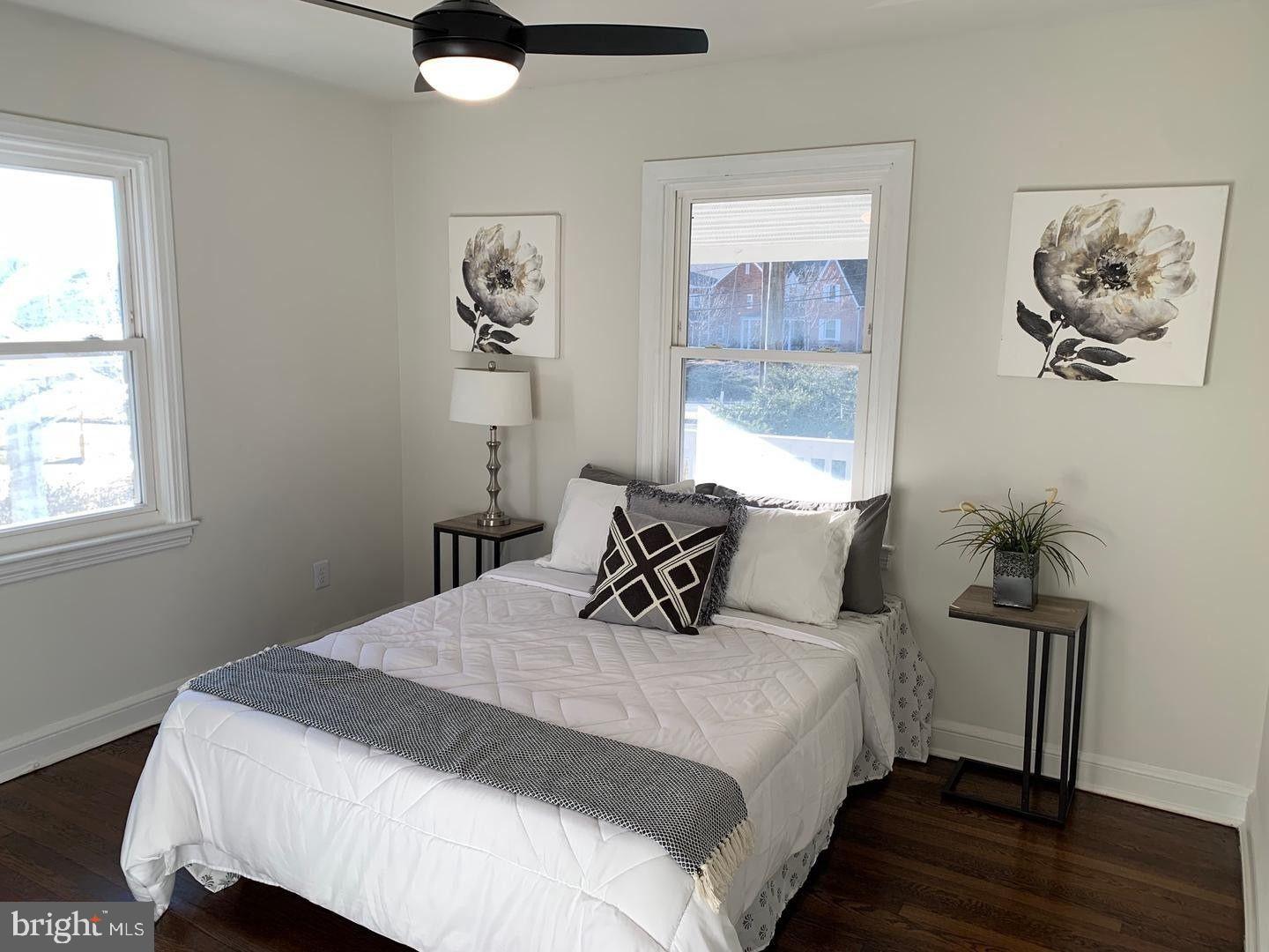 9407 Colesville Road Silver Spring, MD 20901 - Photo 24 of 43 Bright and airy bedroom with floral accents.
