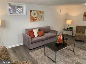 a living room with furniture and a rug