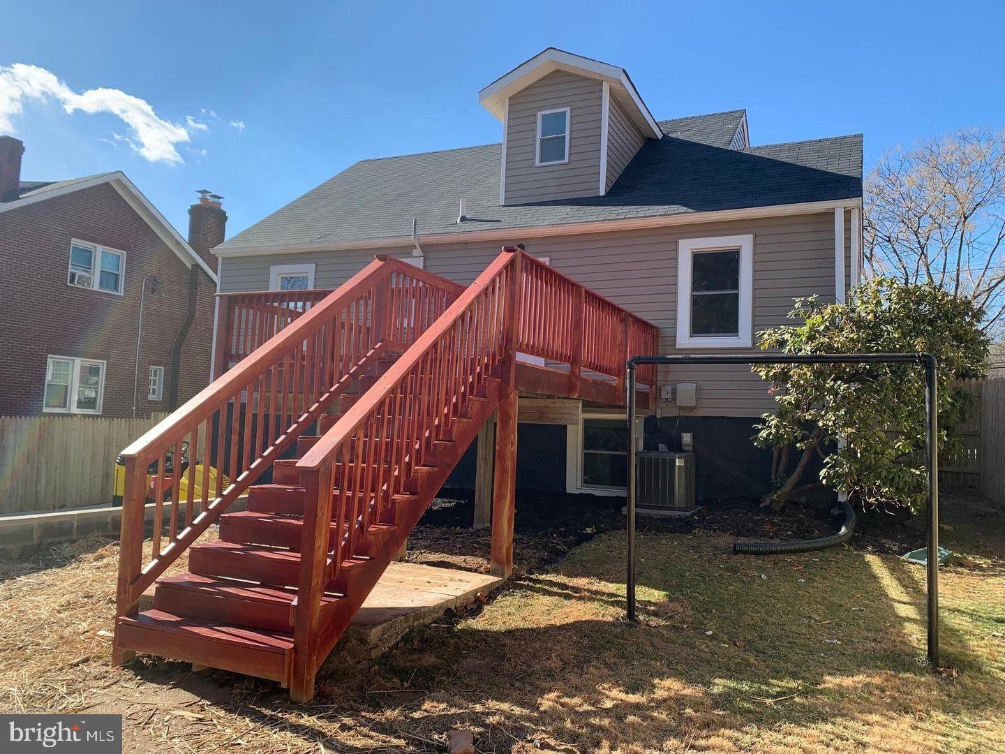 9407 Colesville Road Silver Spring, MD 20901 - Photo 38 of 43 Charming home with inviting red staircase.