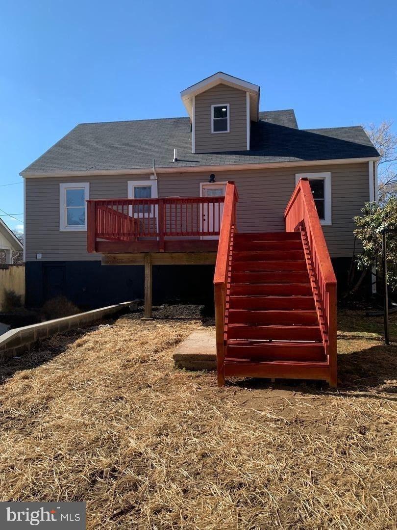 9407 Colesville Road Silver Spring, MD 20901 - Photo 39 of 43 Charming home with vibrant red deck stairs.