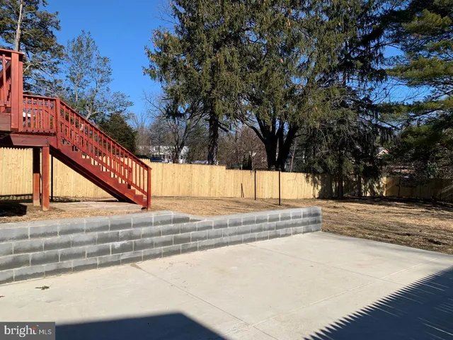 a view of a pathway with a wrought fence