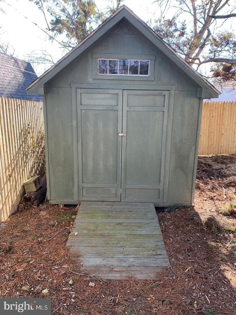9407 Colesville Road Silver Spring, MD 20901 - Photo 43 of 43 Charming garden shed with rustic appeal.