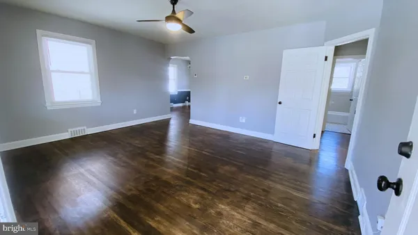 a view of a dining room with furniture wooden floor and a chandelier