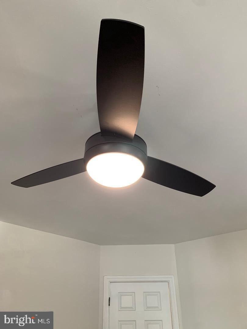 9407 Colesville Road Silver Spring, MD 20901 - Photo 9 of 47 Sleek ceiling fan with modern lighting.