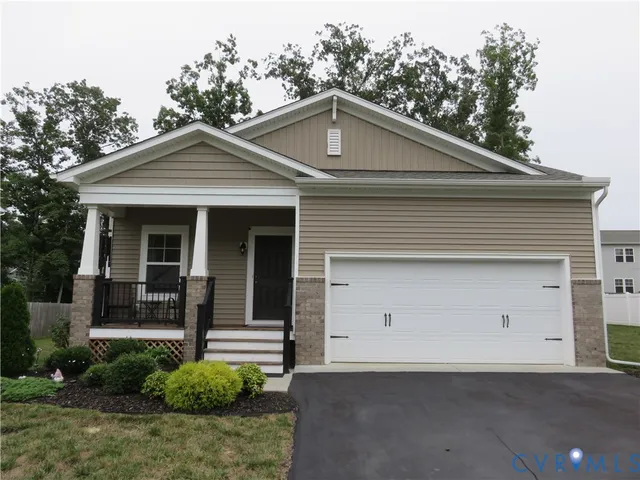 a front view of a house with garage