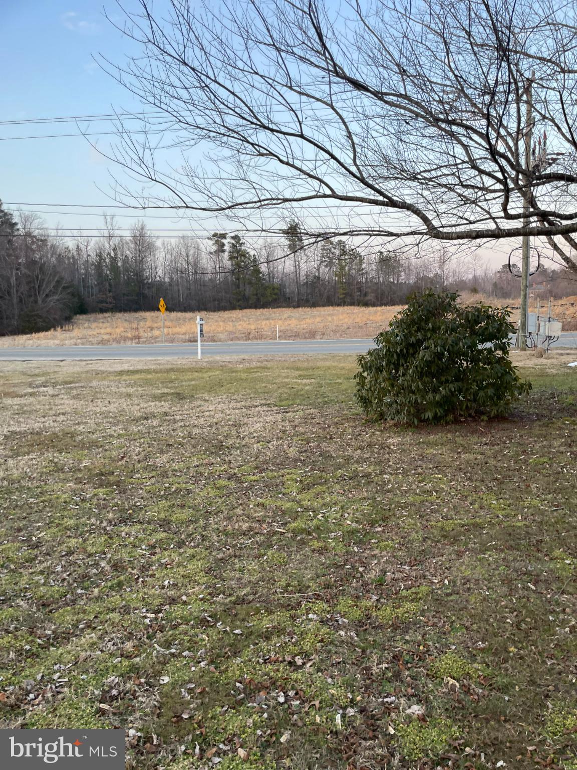 171 Hampton Hall Road Callao, VA 22435 - Photo 2 of 5 Serene landscape with open fields ahead.