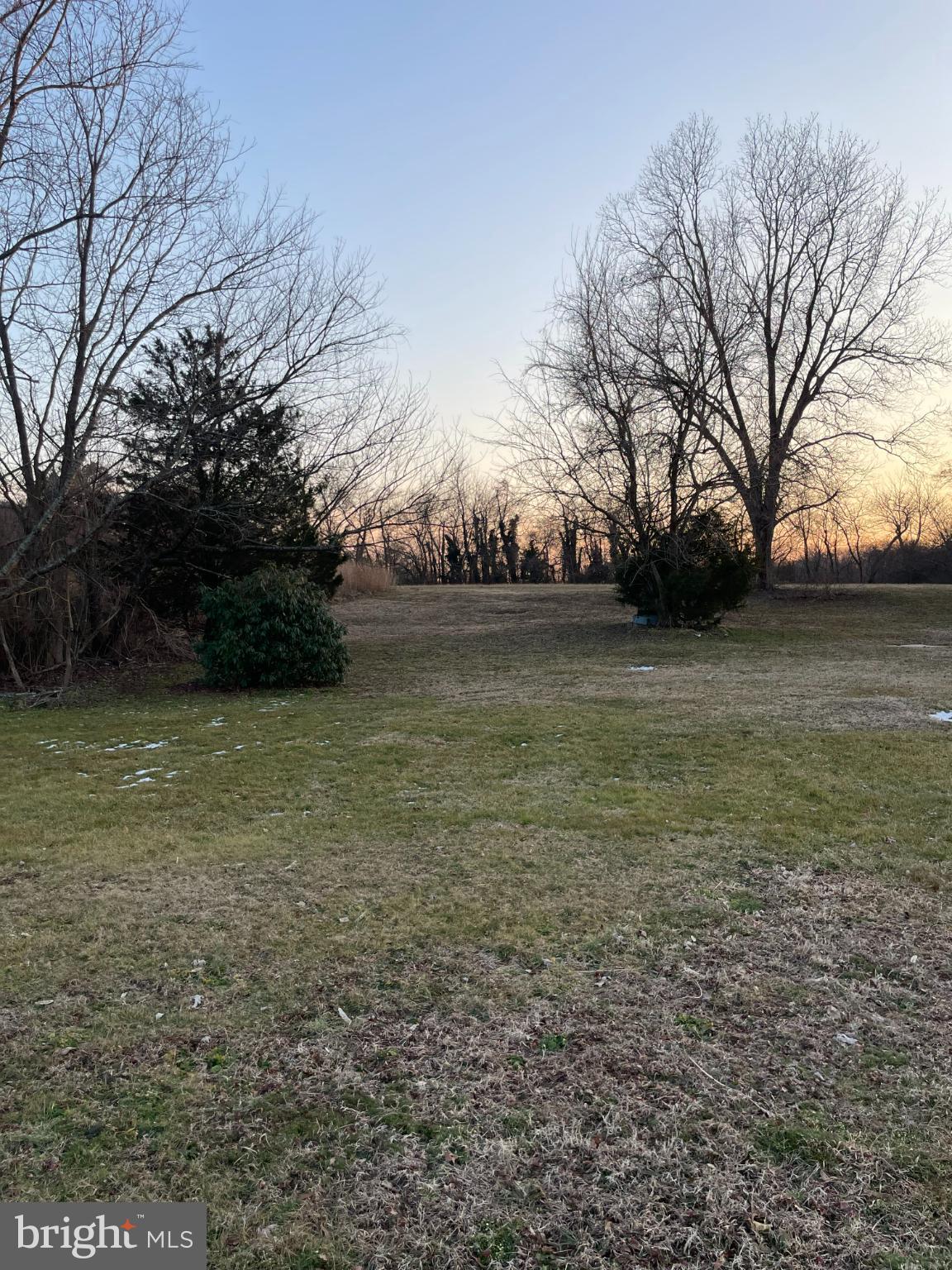 171 Hampton Hall Road Callao, VA 22435 - Photo 4 of 5 Serene landscape at dusk, nature's embrace.