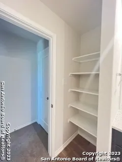 a view of an empty walk in closet