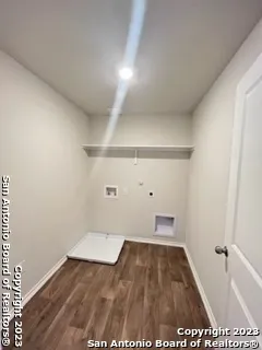 a view of an empty room and wooden floor