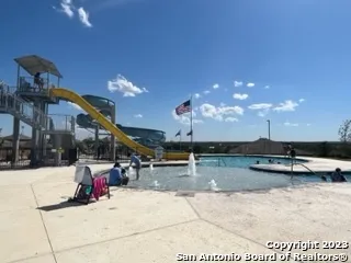 a view of a patio with a table and chairs