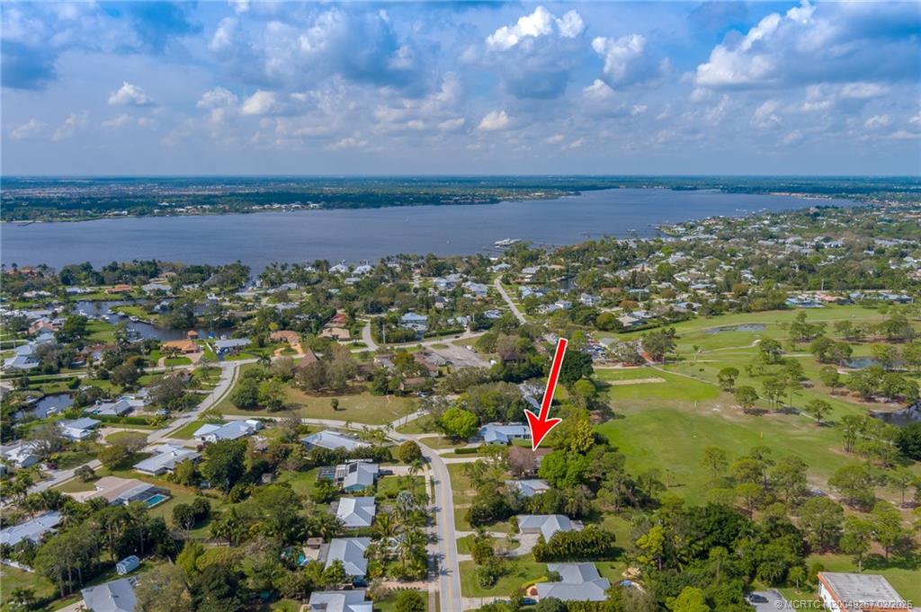 1743 Northwest Spruce Ridge Drive Stuart, FL 34994 - Photo 27 of 31 an aerial view of multiple house