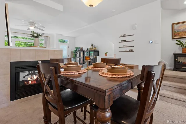 a view of a dining room with furniture and chandelier