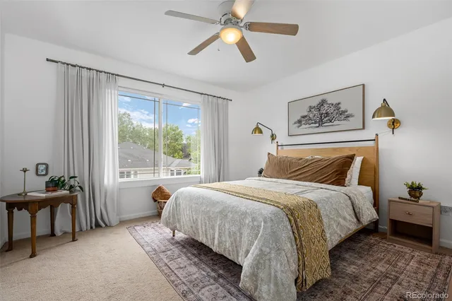 a bed room with a bed and a chandelier