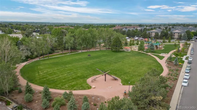 a view of a swimming pool with a yard