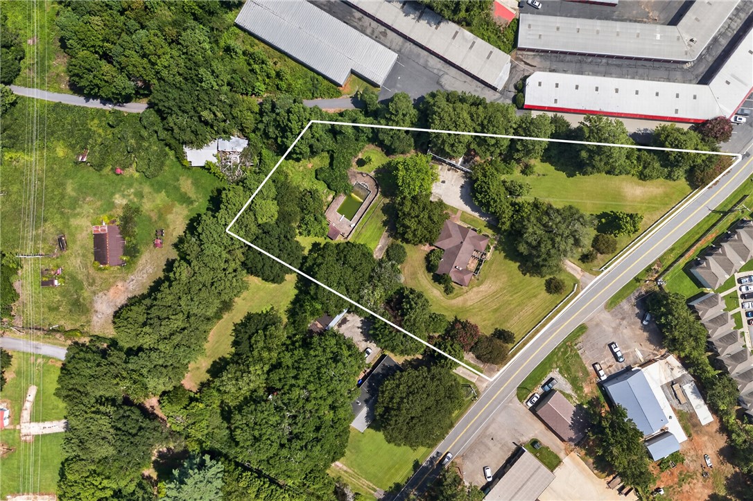1719 Old Central Road Central, SC 29630 - Photo 41 of 45 An aerial perspective shows the extensive property boundaries nestled among mature trees and rolling lawns.