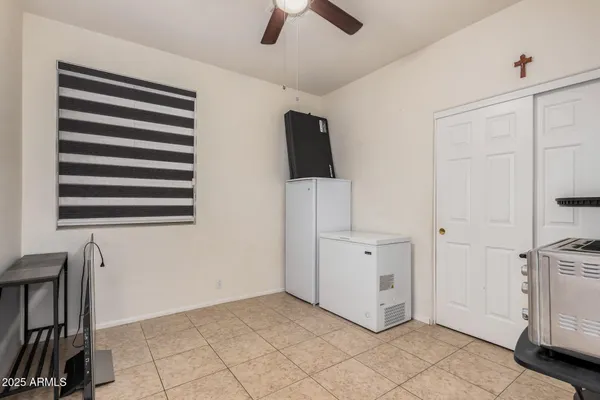 a bathroom with a granite countertop sink and a toilet