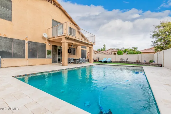 a view of a swimming pool with a patio