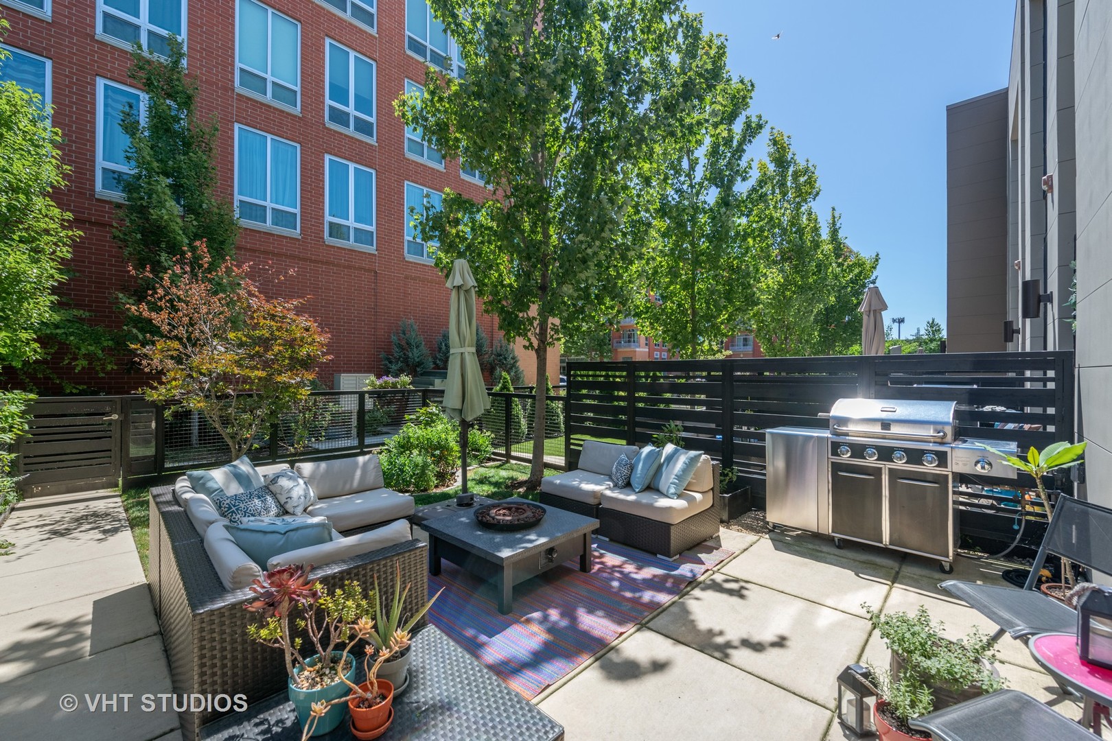 4832 North Clark Street, Unit 117 Chicago, IL 60640 - Photo 13 of 13 a view of backyard with outdoor seating a patio and plants