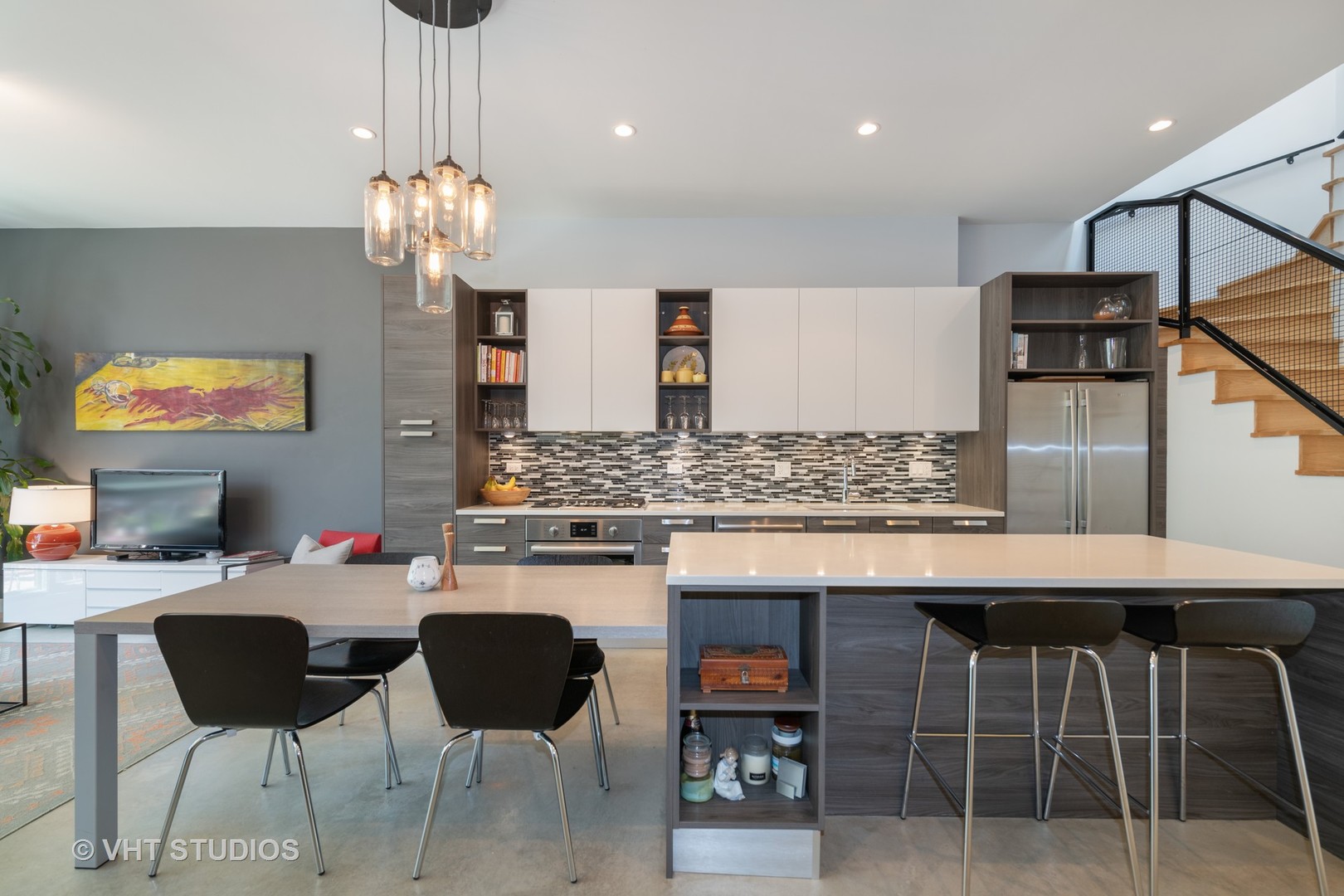 4832 North Clark Street, Unit 117 Chicago, IL 60640 - Photo 4 of 13 a kitchen with a table and chairs in it