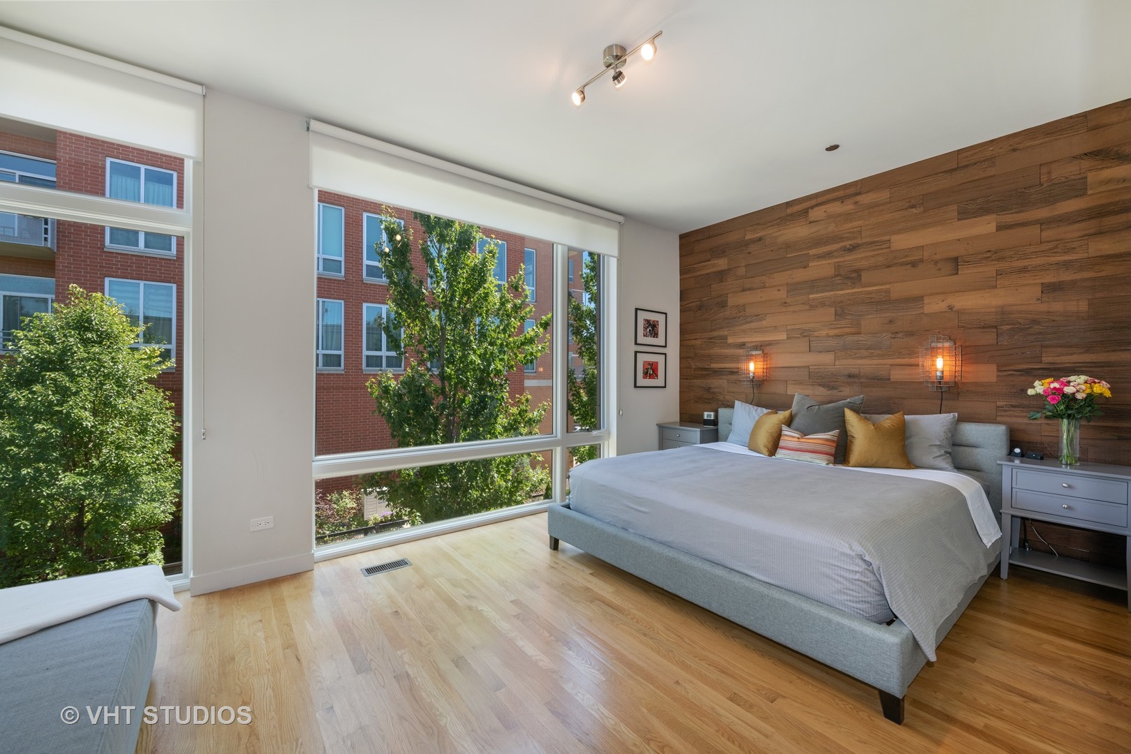 4832 North Clark Street, Unit 117 Chicago, IL 60640 - Photo 8 of 13 a bedroom with a bed and large window