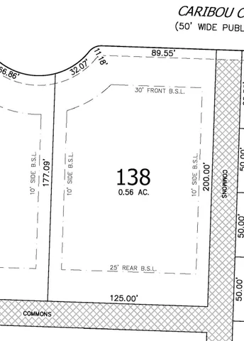 a picture of a room with a white bed and a mirror