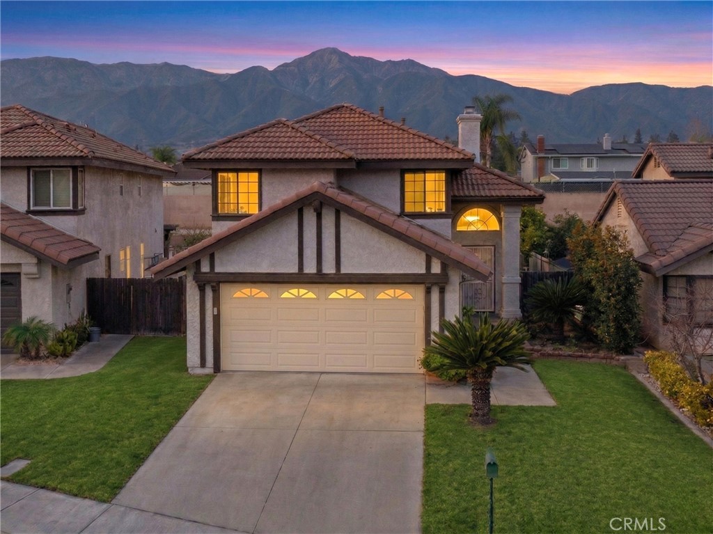 10536 Deerfield Drive Rancho Cucamonga, CA 91701 - Photo 1 of 28 a front view of house with yard and trees